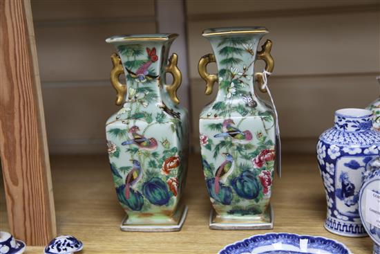 A pair of Chinese famille rose celadon ground vases, two blue and white vases and a spoon tray, all Qing dynasty